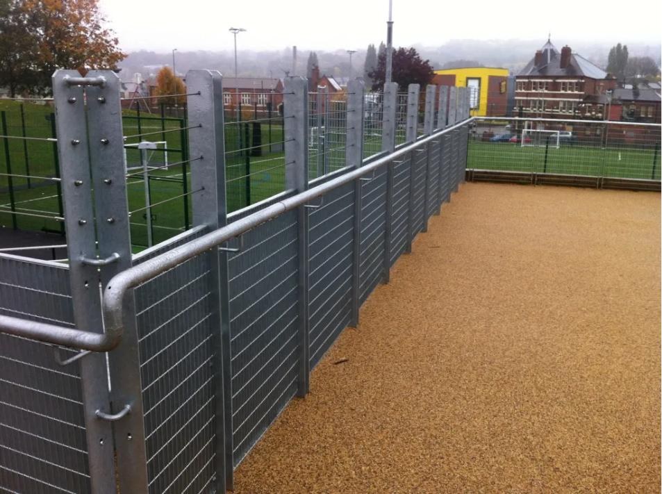 Galvanised steel baluster posts with electro welded mesh infill panels and stainless steel wire ropes above, on a Sheffield terrace